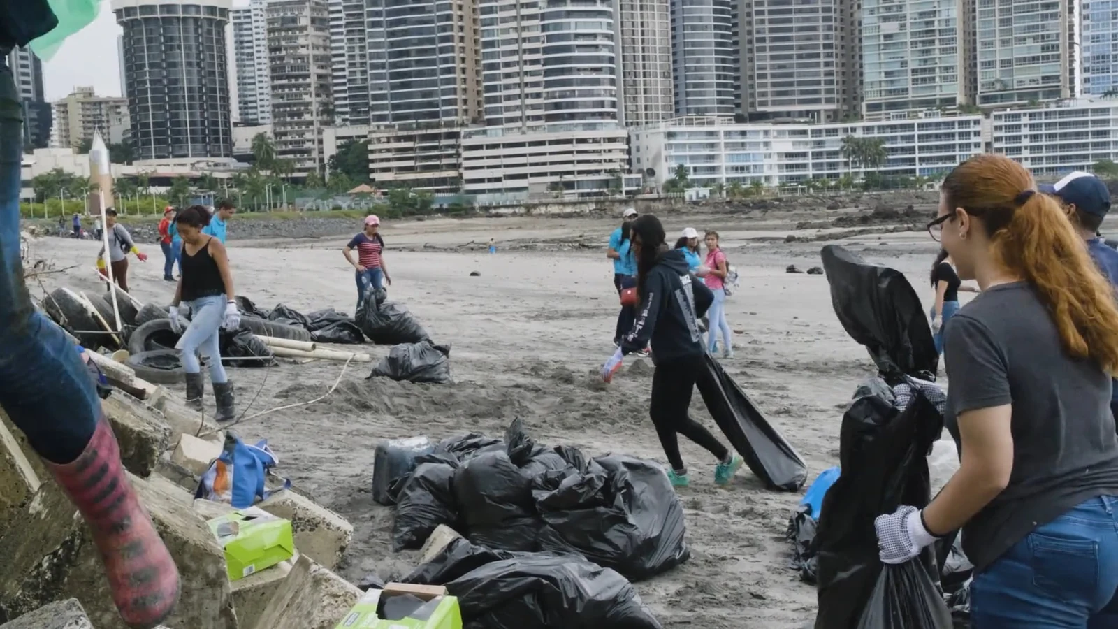 Pick up trash on the beach