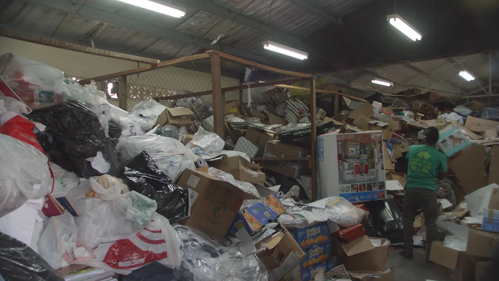 Volunteer at the recycling collection centre